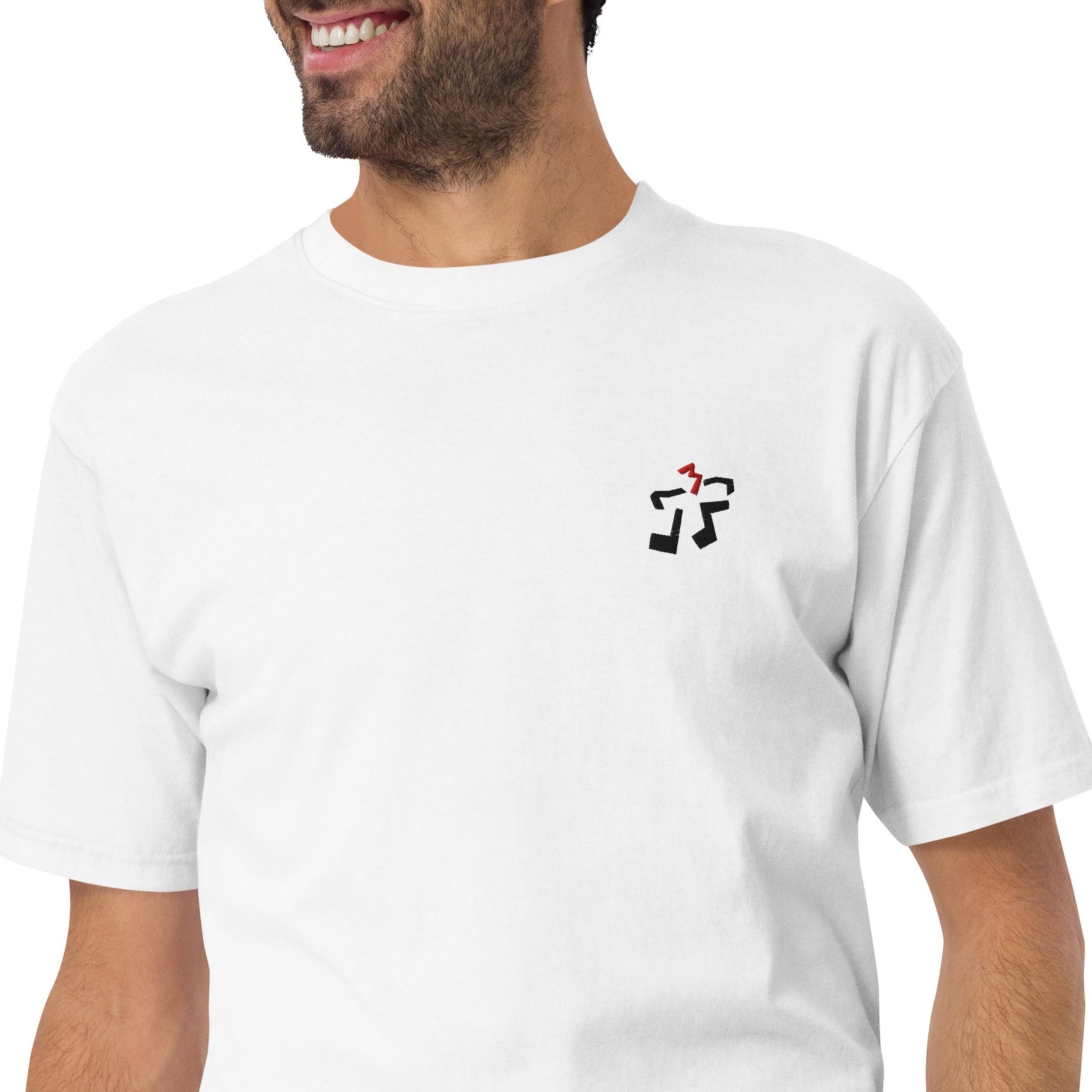 A close-up of the heavyweight fabric of the swing feel Tee as worn, showing its structured drape and embroidery.